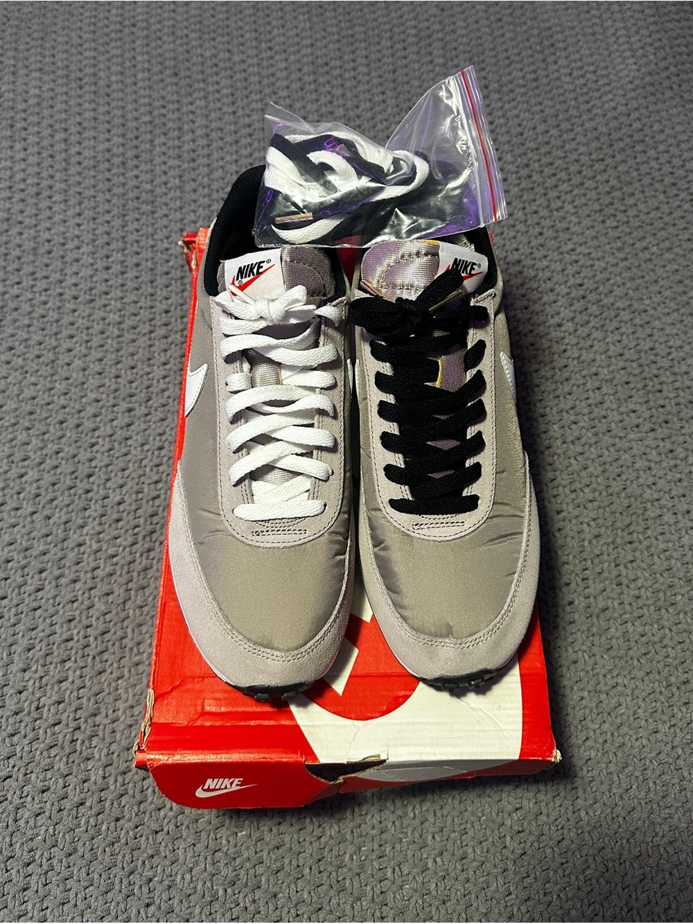 Nike Gray Suede Sneakers with White Swoosh and Mixed Laces